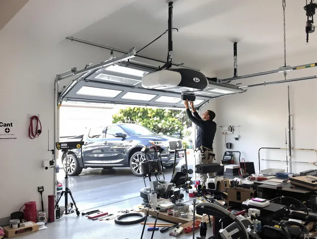 Ellington Garage Door Repair specialist installing smart garage door opener system in Ellington home